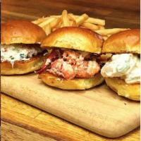 Seafood Slider · Maine style lobster salad, shrimp salad and crab salad on a brioche slider. Served with home...