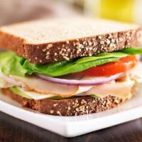 Turkey Club · With bacon, lettuce and tomato.