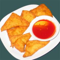 Pearl River's Cream Cheese Fried Wontons · 6 pieces. A family recipe of marinated cream cheese wrapped in wonton skins served with swee...