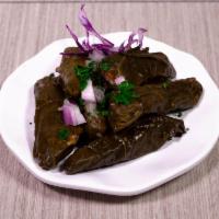 Doulma · Stuffed grape leaves, with rice, tomatoes, parsley, onions and lemon juice. Minimum 6 order.