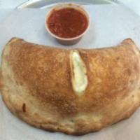 Cheese Calzone · Housemade and baked to order,filled with ricotta,Parmesan and mozzarella cheeses. Served wit...