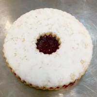 Linzer Tart Cookie · A soft buttery shortbread style cookie with imported raspberry preserves and a sprinkle of p...