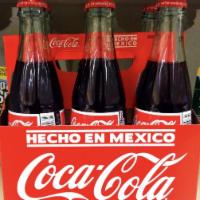 Bottled Mexican Coke · Made with cane sugar