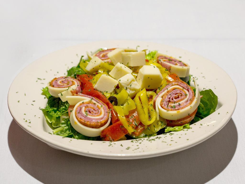 Antipasto Salad · Our large garden salad topped with Italian cold cuts and cheeses, red peppers and banana peppers.