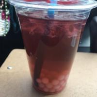 Purple Magic Tea · Pomegranate and blueberry with green tea and yogurt pop pearls. 