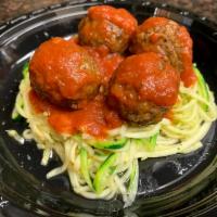 Vegan Meatball Zucchini Spaghetti · Plant-based meatball and zucchini pasta with a tomato basil sauce. Choice to add Parmesan un...