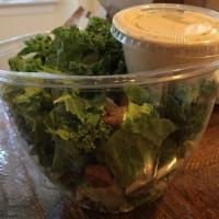 Kale Caesar Salad · Chopped kale and romaine hearts, shaved Parmesan cheese and croutons with creamy Caesar dres...