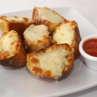 Garlic Bread with Cheese · 6 pieces of garlic bread topped with mozzarella cheese and side of marinara sauce.