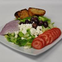 Greek Salad · Crispy romaine lettuce, tomatoes, red onions, Kalamata olives and feta cheese.