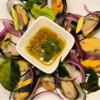 14. Steamed Mussel · Mussels with lemon grass, onions, and fresh basil served with spicy seafood sauce.  Hot and ...
