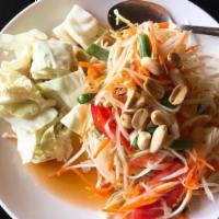 26. Papaya Salad · Green papaya strips, green beans, tomatoes, peanuts in a spicy lime sauce. Hot and spicy.