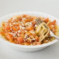Greek Spaghetti · Garlic butter, oregano and fresh-cut tomatoes served over pasta and topped with crumbled fet...