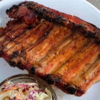 We Love Ya Baby Back Ribs · Slow Smoked Baby Back Ribs Cooked to Perfection with Our Own Special Rub! (1/2 Slab)