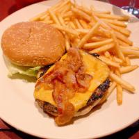 Cheese Burger Deluxe · Topped with yellow American cheese, slice tomato, onions and lettuce.