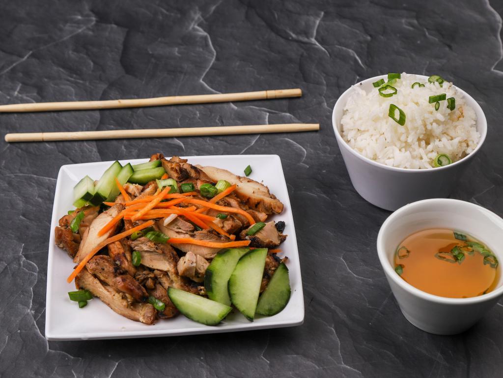 10. Rice with Grilled Chicken · Served with cucumbers and carrots with a side of fish sauce.
