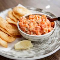 Salmon Wonton Chips * · A fine mixture of salmon sashimi, tomato, onion, cilantro, and tobiko served with crispy won...