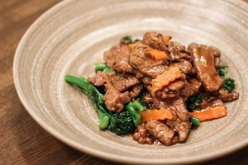 Beef and Broccolini · Premium flank steak, fresh broccolini, and carrot stir-fried in garlic oyster sauce