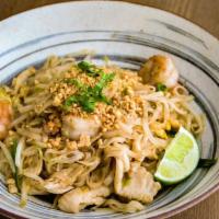 Pad Thai · Flat rice noodles stir-fried with shrimp, chicken, bean sprouts, peanuts, and basil