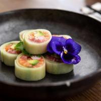 Cucumber Wrapped Maki *(G) · Tuna, salmon, avocado, and kanikama wrapped in fresh cucumber and drizzled in house special ...