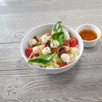 Fresh Mozzarella Salad · Fresh pulled mozzarella cheese, fire-roasted red peppers, tomatoes, hand-picked basil, Kalam...