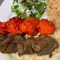 Lamb and Chicken Combo · 1 skewer of chicken cubes, 1 skewer of lamb cube served with rice, tandoori bread salad and ...