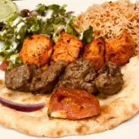 Beef and Chicken Combo · 1 Skewer of beef cube, 1 Skewer of chicken cubes  Served with salad, rice and fresh grill ve...