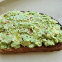 Classic Avocado Toast · Smashed avocado, red pepper flakes, EVOO, on sourdough bread.