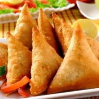 Mini Samosa · Fried crisp pastry with mixed vegetables.