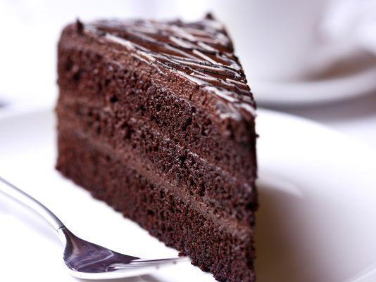Chocolate Cake · Creamy hot chocolate cake with vanilla ice, garnished with strawberry syrup.