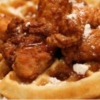CHICKEN 'N WAFFLES  · Waffle , Chicken of your choice with a side of maple syrup and a dipping sauce .