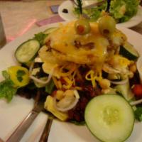 Cheeburger Cheeburger Salad · Topped with a 1/4 lb. of our natural Angus beef, including your choice of cheese. Includes a...