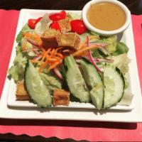 Thai Salad · Lettuce, tofu, eggs, tomatoes, cucumber, carrots, red onions and fresh coriander with side o...