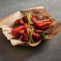Buffalo Wings · 10 pieces. Fresh wings roasted, then deep fried and tossed in Louisiana hot sauce, mild sauc...