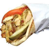 CHICKEN SHAWARMA PITA · Seared bits of Marinated chicken thighs, pickles, and tomatoes with choice of sauce.