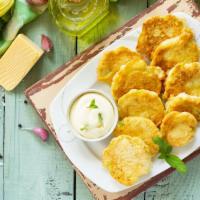 Beer Battered Zucchini · Fresh cut zucchini, dipped in homemade beer batter, breaded, deep fried and served with a si...