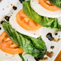 Caprese Salad · Cut to order fresh Roma tomatoes and basil leaf with a healthy selection of fresh Buffalo mo...