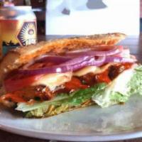 Chicken Parmesan Sub · Hand breaded and skillet baked chicken breast served with homemade marinara sauce, shaved Pa...