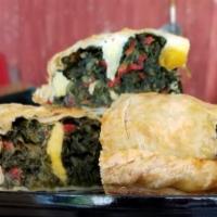Pascualina Spinach Pie · Traditional uruguayan puff pastry composed of spinah , red peppers, onions and hard boiled e...