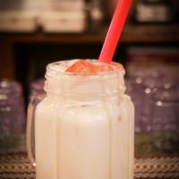 Chicha · Made with rice and condensed milk sweet refreshing beverage topped with ground cinnamon- non...