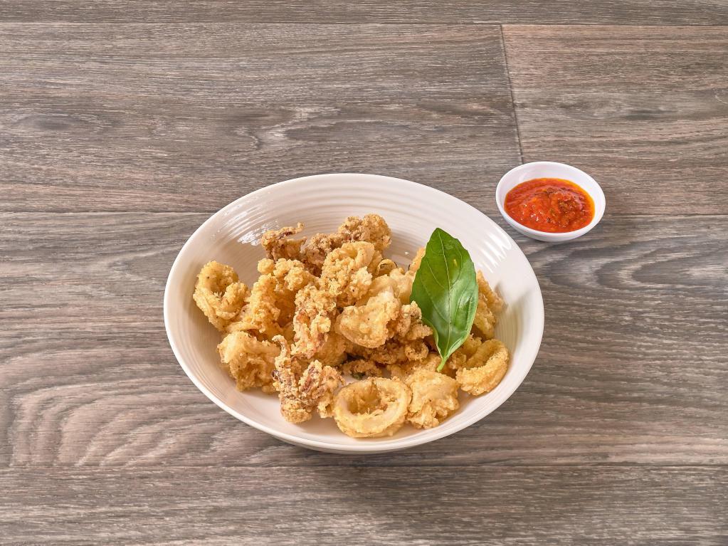 Fried Calamari · Lightly dusted, fried to a golden brown and served with marinara sauce.