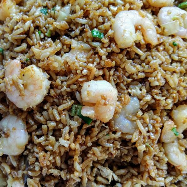 14. Fried Rice  Combination  · Fried rice stirred- fried with chicken, beef, shrimp, egg, and small pieces of peas, carrots, onion.