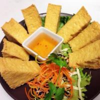 Fried Tofu · Fried bean curd served with sweet and sour sauce topped with crushed peanut. 