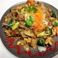 Drunken Noodles · Wide rice noodles with bell peppers, bean sprouts, carrots, pea pods, baby corn, tomatoes, o...