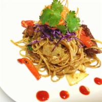 Spaghetti Pad Kee Mao · Basil leaf, bell pepper, onion, egg and tomato with spaghetti noodles.