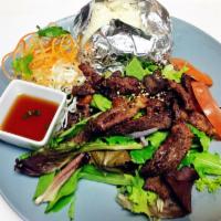 Tiger Cries · Thai grill steak with spicy sauce on the side, served with sticky rice. 
