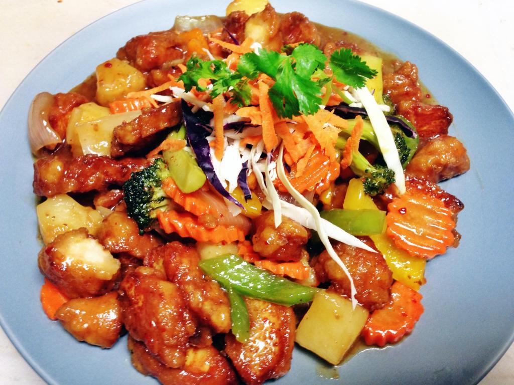 Sweet and Sour Chicken · Crisp battered chicken, pineapple, peapods, bell peppers and mushroom in house special sweet and sour sauce. 
