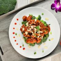 Almond Sriracha Chicken · Tender marinated chicken with broccoli, sriracha and almond