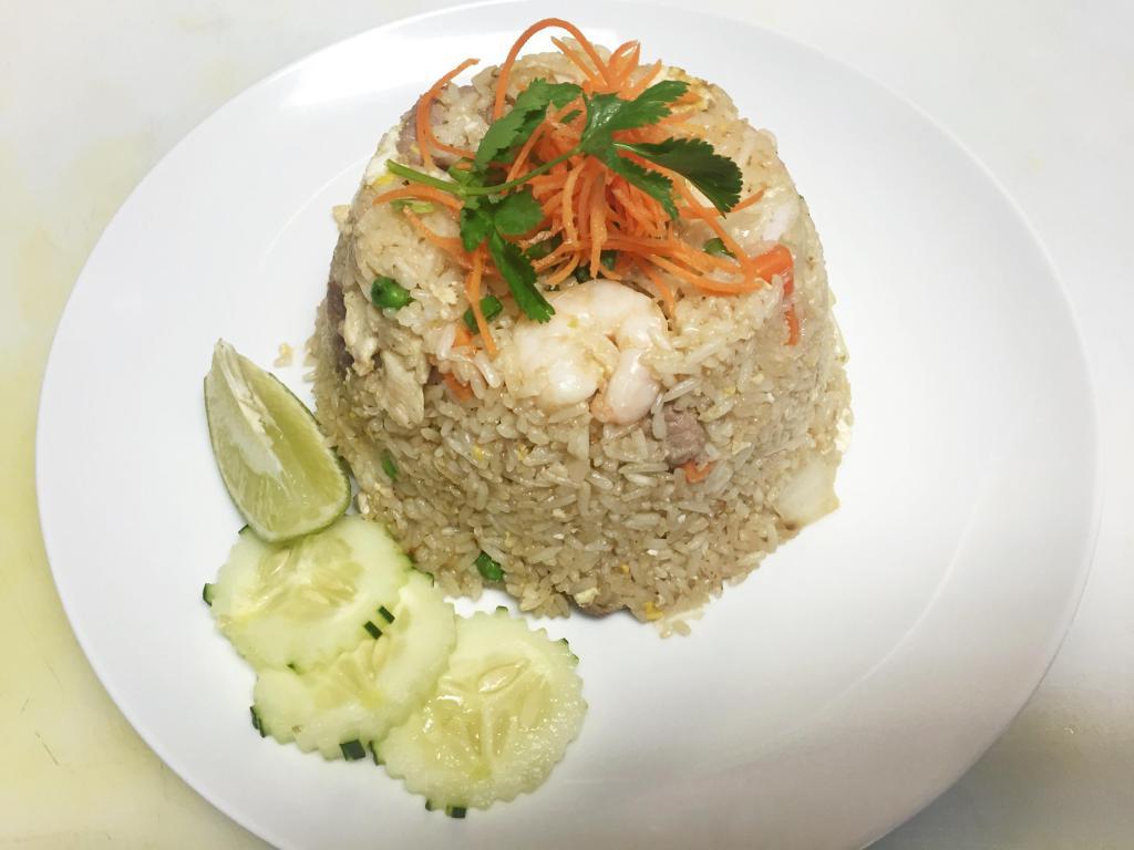 Combination Fried Rice · Stir fried rice with egg, carrot, onions, green beans, chicken, beef and shrimp. 