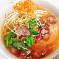BBQ Pork & Egg Noodles And Wonton  · BBQ pork and egg noodle soup with bean sprouts, scallions and basil leaves. 