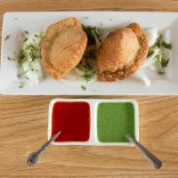 Chicken Samosas (2 Pieces) · Triangular puffed pastry, spiced with paach-foron.  Stuffed with minced chicken, potatoes, g...